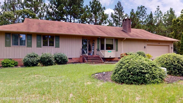 ranch-style home with a front lawn and a garage