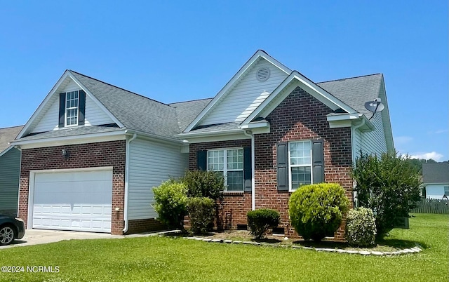 view of front of home featuring a front yard and a garage