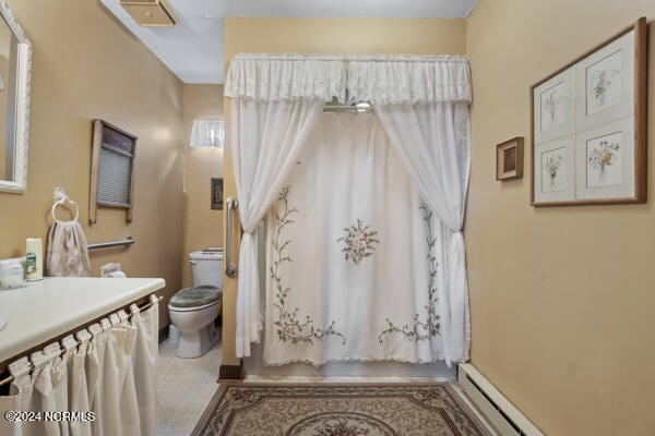 bathroom with tile patterned floors, toilet, and vanity