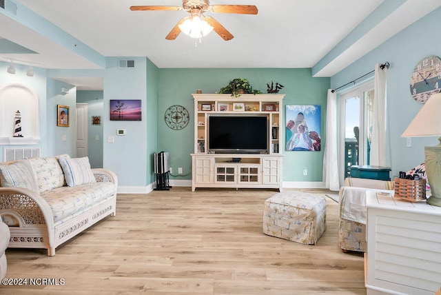 living room featuring light wood-type flooring and ceiling fan