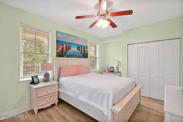 bedroom featuring a closet, ceiling fan, and light hardwood / wood-style floors