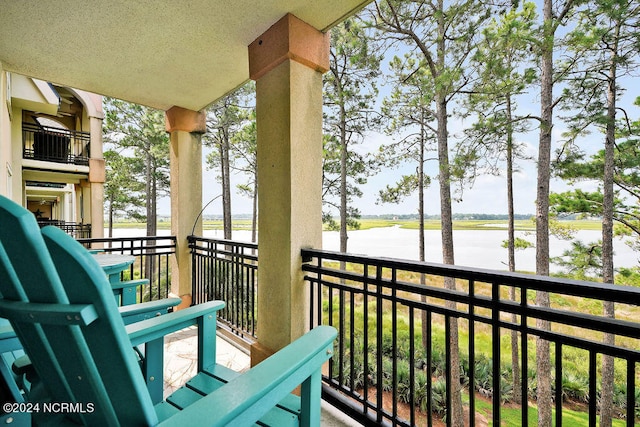 balcony featuring a water view