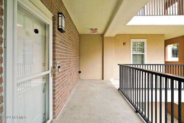 doorway to property featuring a balcony