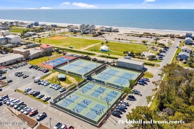 bird's eye view featuring a water view and a view of the beach