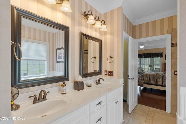 ensuite bathroom featuring crown molding, a sink, ensuite bath, and wallpapered walls