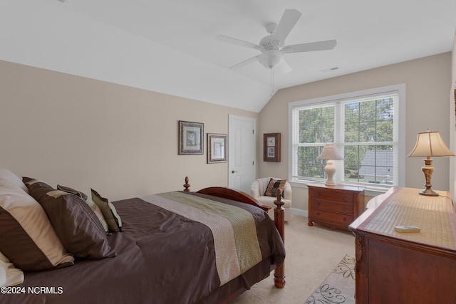 bedroom featuring lofted ceiling, a ceiling fan, visible vents, and light colored carpet