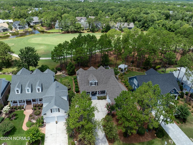 drone / aerial view with a residential view and a water view