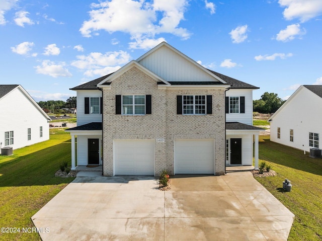 view of front of property featuring a garage, a front yard, brick siding, and driveway