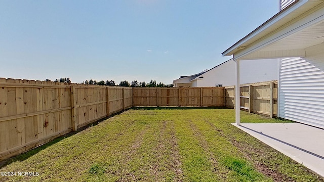 view of yard with a fenced backyard