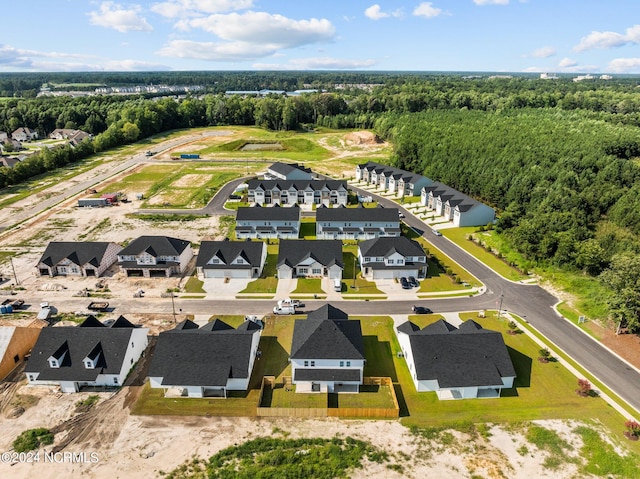 bird's eye view with a residential view and a view of trees