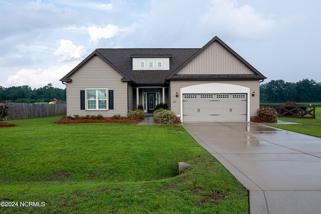 view of front facade featuring a garage and a front yard