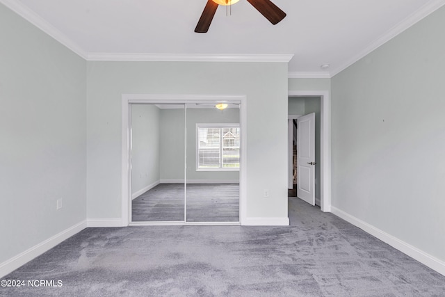 unfurnished bedroom featuring ceiling fan, ornamental molding, carpet floors, and a closet