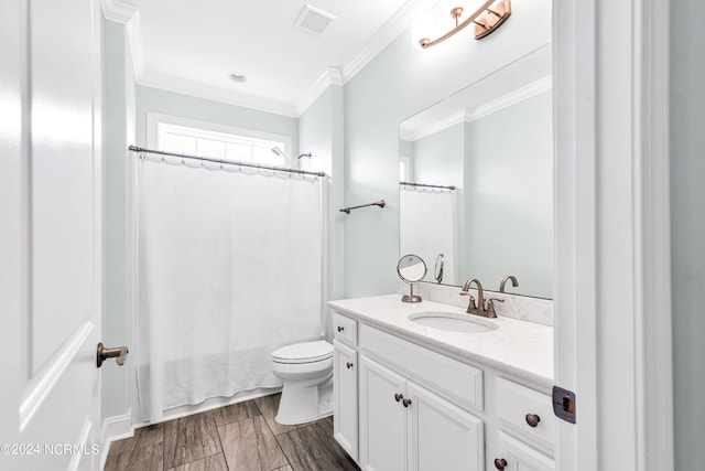 bathroom with hardwood / wood-style flooring, vanity, ornamental molding, and toilet