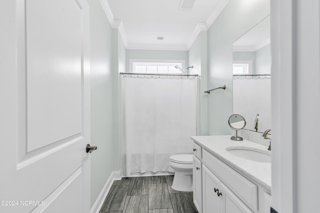 bathroom featuring toilet, ornamental molding, vanity, and tile patterned flooring