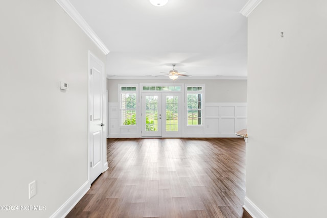 unfurnished room featuring ceiling fan, ornamental molding, french doors, and wood-type flooring