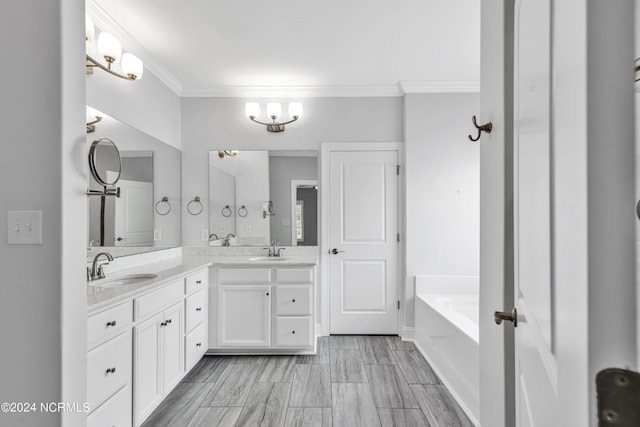 bathroom featuring double vanity, a washtub, crown molding, and tile patterned floors