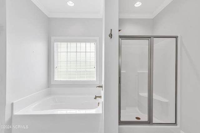 bathroom featuring crown molding and independent shower and bath