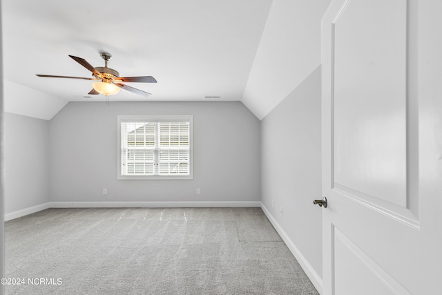 bonus room featuring ceiling fan, lofted ceiling, and light carpet