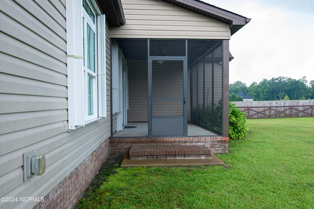 property entrance featuring a yard