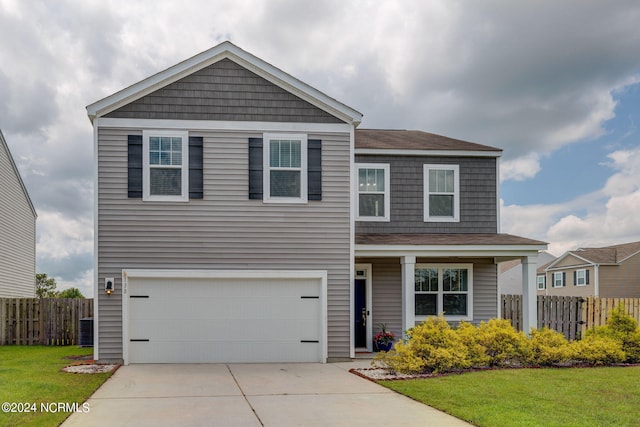 view of front facade featuring a garage and a front yard