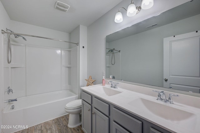 full bathroom featuring shower / bathing tub combination, wood-type flooring, toilet, and double sink vanity