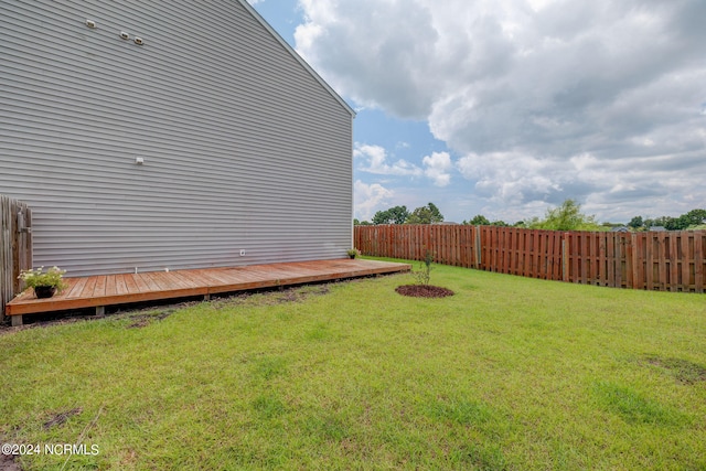 view of yard featuring a wooden deck