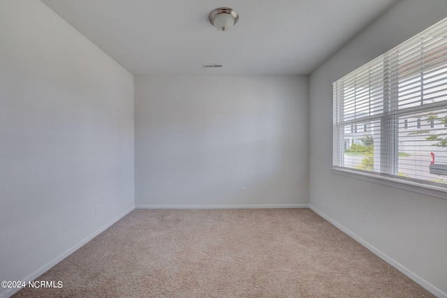 empty room featuring light colored carpet