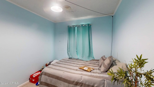 carpeted bedroom with crown molding