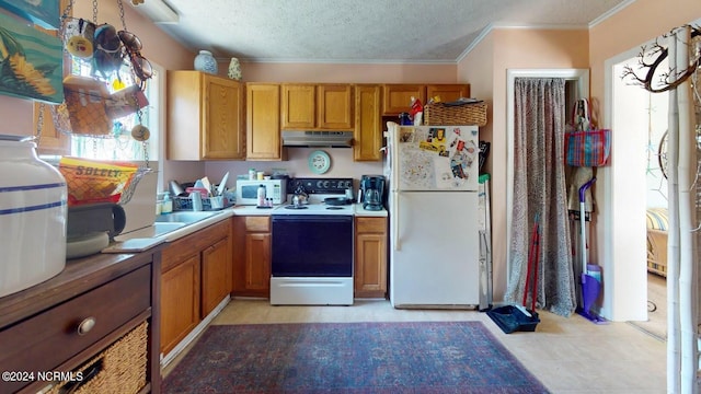 kitchen with crown molding, white appliances, and a textured ceiling