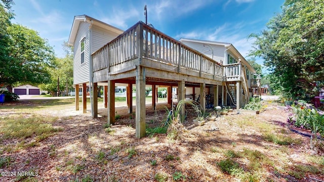 back of house with a wooden deck