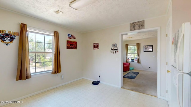 spare room featuring a textured ceiling