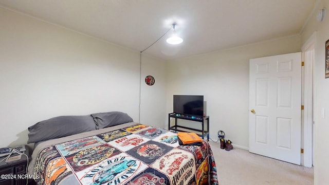 bedroom featuring light carpet