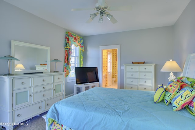 bedroom featuring carpet, a ceiling fan, and connected bathroom