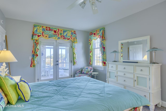 bedroom featuring access to exterior, french doors, and a ceiling fan