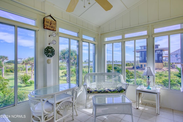 unfurnished sunroom featuring lofted ceiling and a ceiling fan