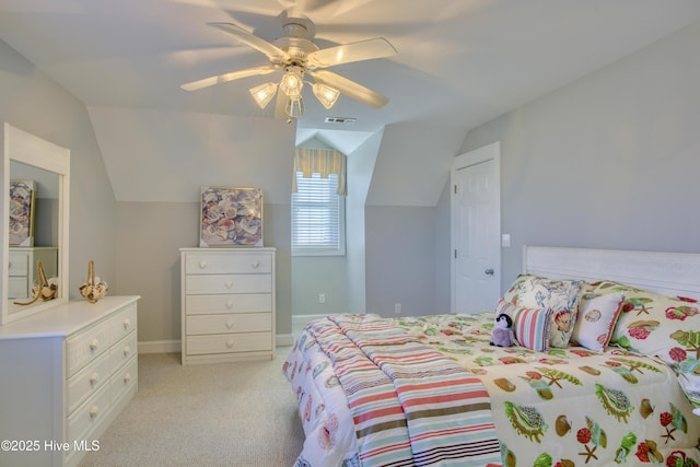 bedroom with lofted ceiling, light colored carpet, visible vents, a ceiling fan, and baseboards