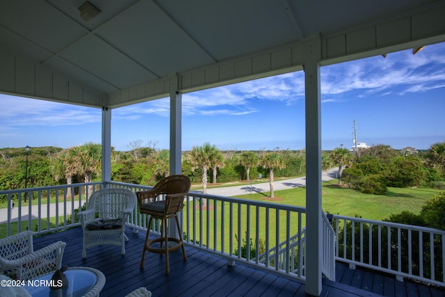 deck featuring a lawn