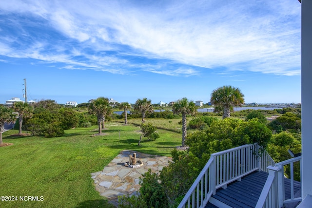 view of yard with an outdoor fire pit and a patio