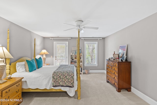 bedroom with light carpet and ceiling fan