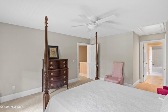 carpeted bedroom with connected bathroom and ceiling fan