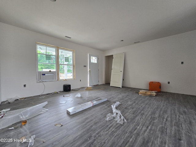 235 Nugget Trl, Elizabeth City, NC 27909 - unfurnished living room with wood finished floors and cooling unit