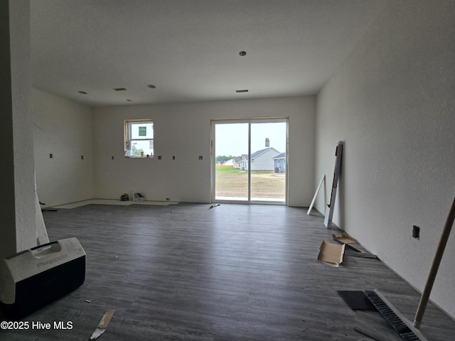 235 Nugget Trl, Elizabeth City, NC 27909 - unfurnished living room with wood finished floors and a textured wall