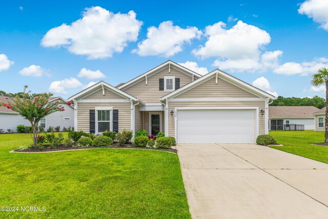 view of front facade featuring a garage and a front lawn