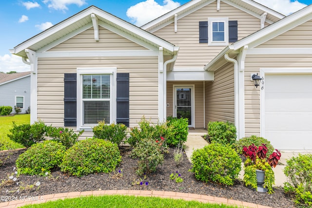 view of front of property with a garage