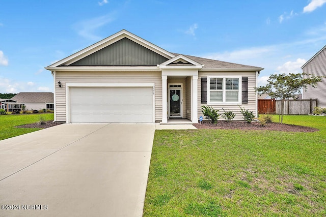 view of front facade with a garage and a front yard