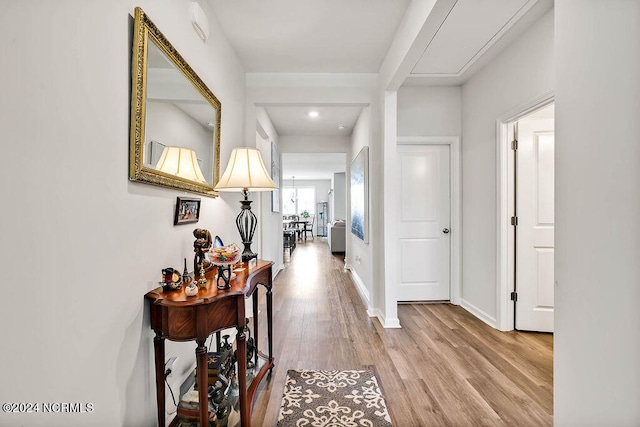 corridor featuring hardwood / wood-style floors