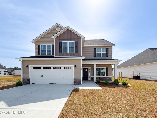 view of front of property with a garage, central AC, and covered porch