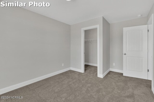 unfurnished bedroom featuring light colored carpet