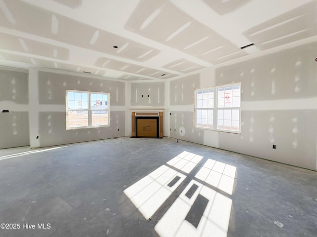 unfurnished living room featuring a healthy amount of sunlight