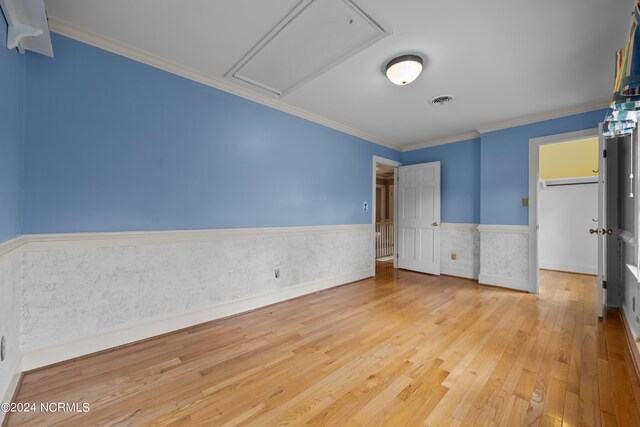 unfurnished bedroom featuring light hardwood / wood-style floors and ornamental molding